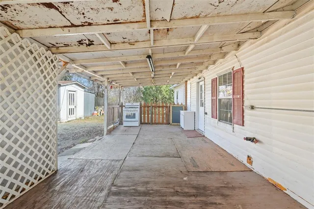 a view of a backyard with large trees