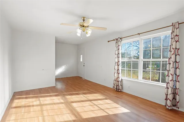 a view of an empty room with a window