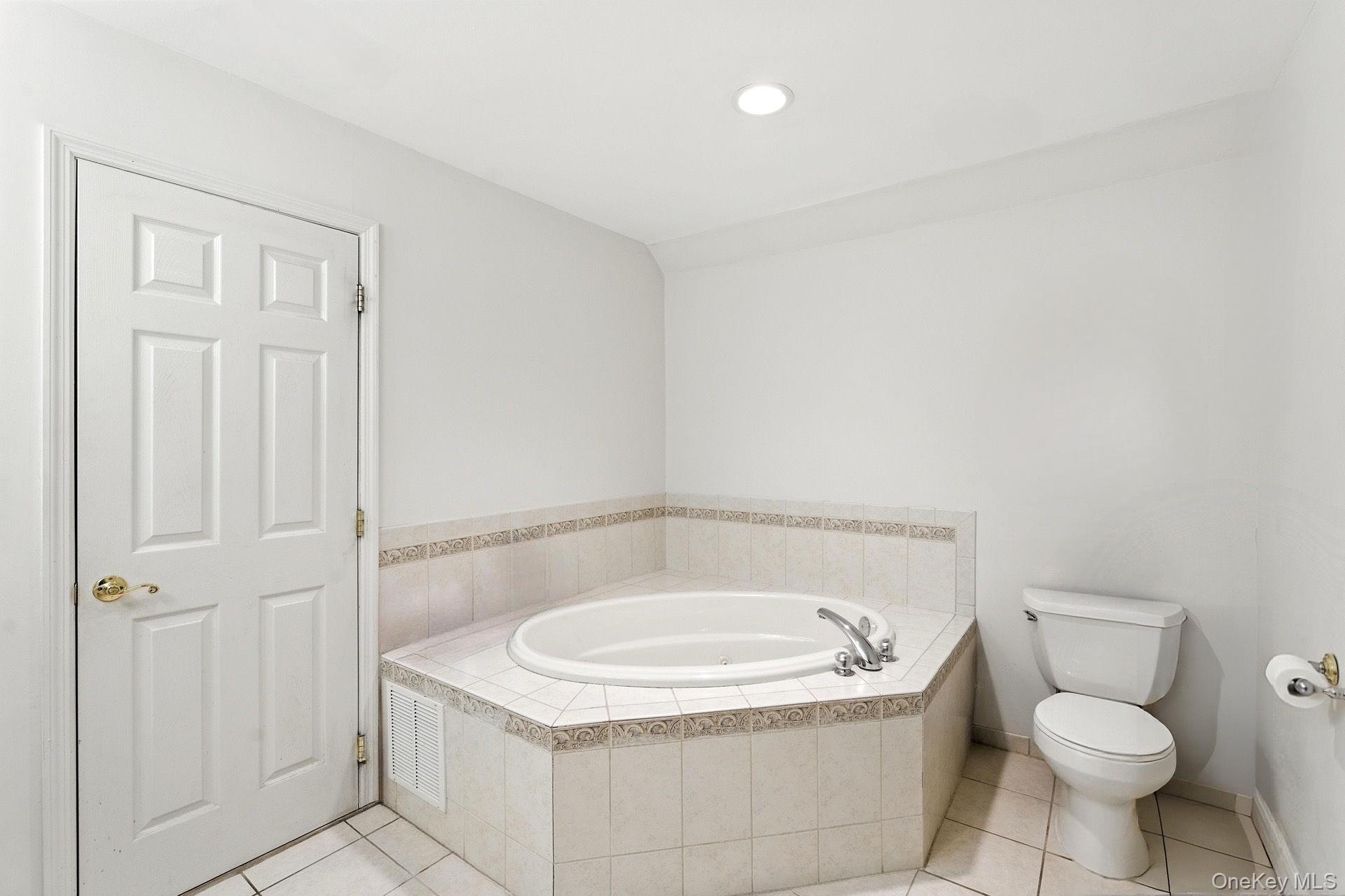 33 Sunflower Ridge Road Centereach, NY 11720 - Photo 11 of 20 Primary bathroom featuring a jacuzzi tub.