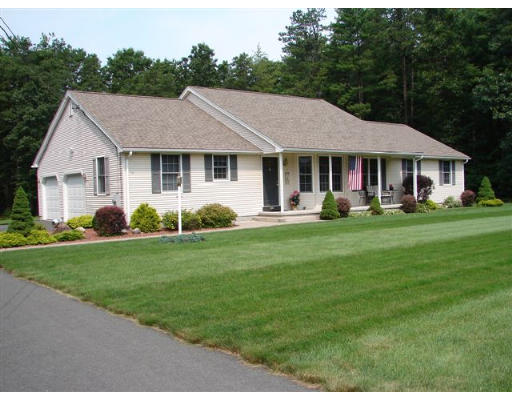 216 County Road Southampton, MA 01073 - Photo 1 of 4 a front view of a house with a yard potted plants and large tree
