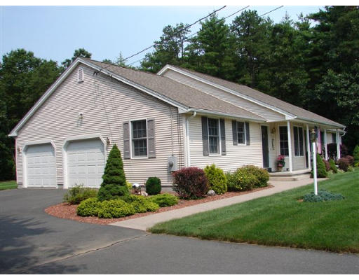 216 County Road Southampton, MA 01073 - Photo 2 of 4 a front view of a house with a yard and potted plants
