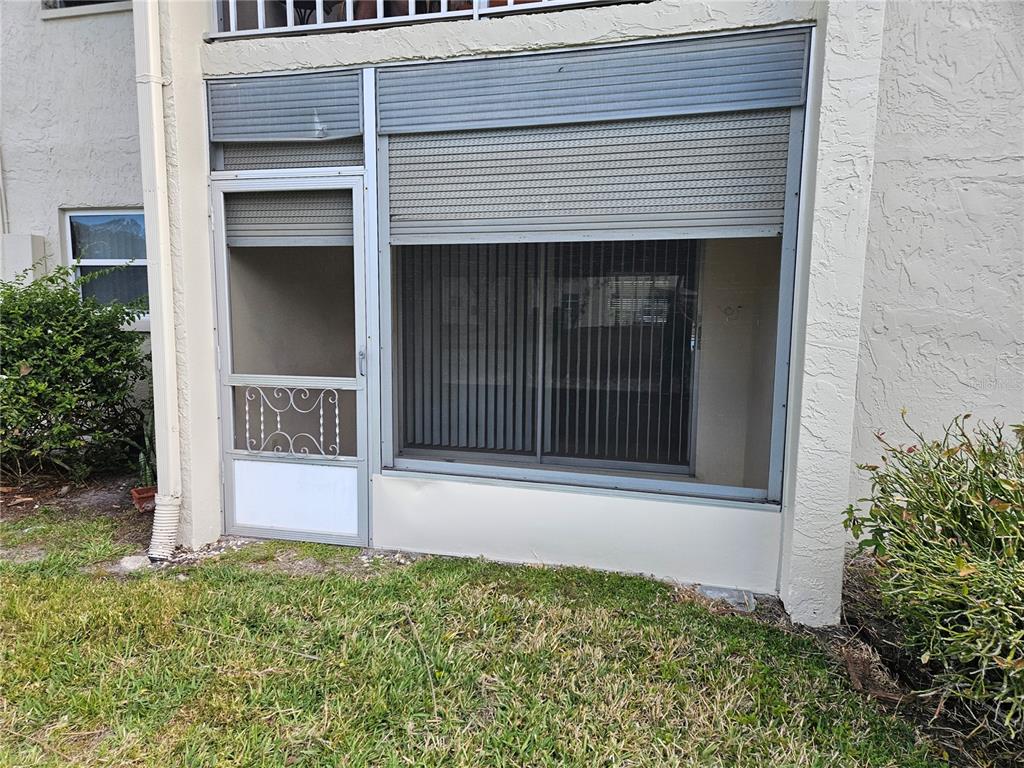 946 Virginia Street, Unit 104 Dunedin, FL 34698 - Photo 12 of 23 a view of entrance gate of the house