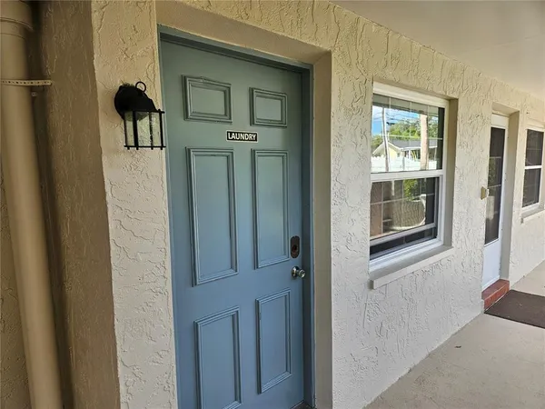 a view of a yard with cars parked