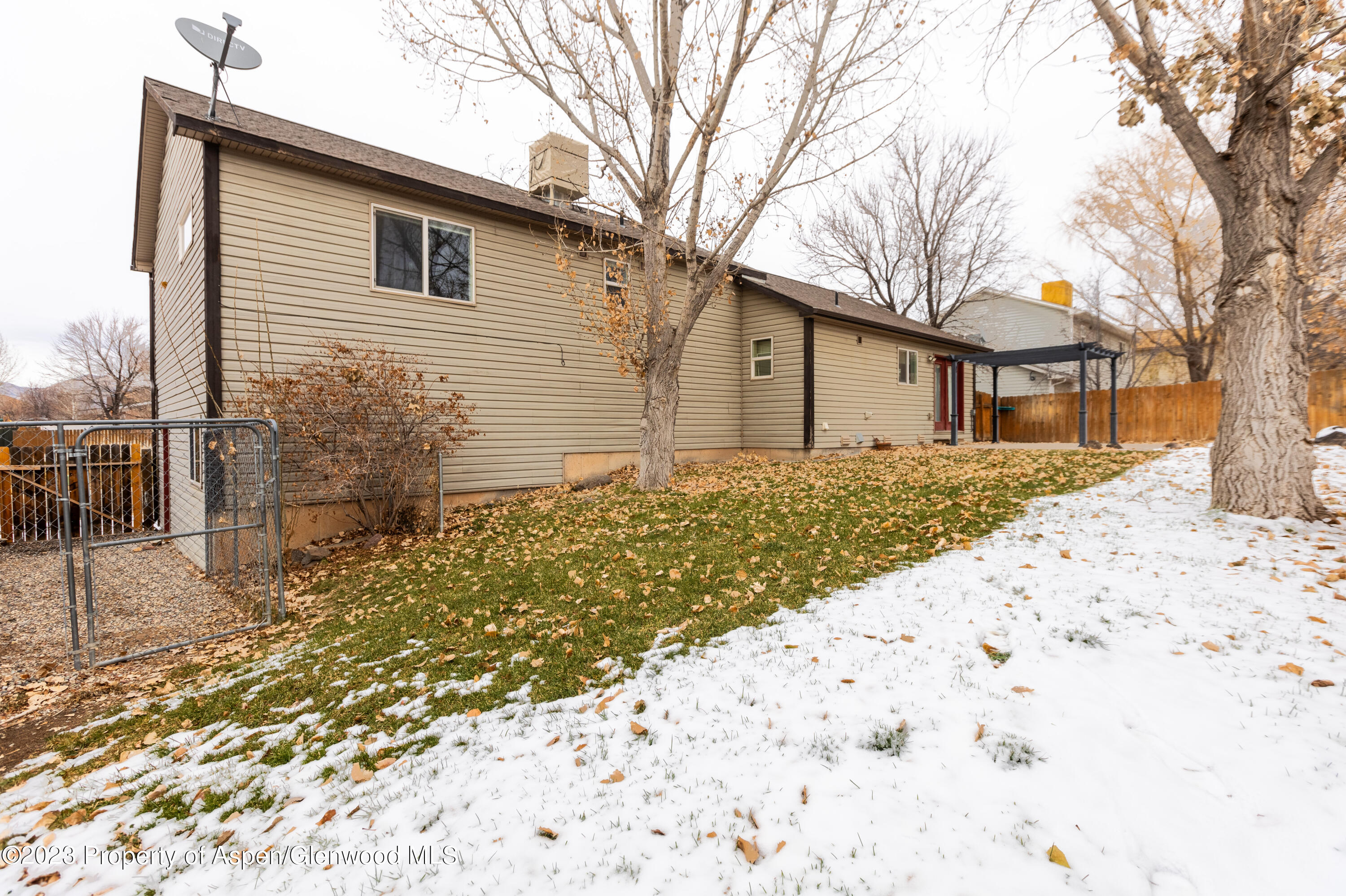 745 East 18th Street Rifle, CO 81650 - Photo 23 of 23 a backyard of a house with large tree