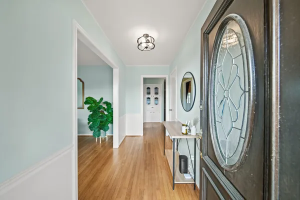 a view of a entryway with wooden floor