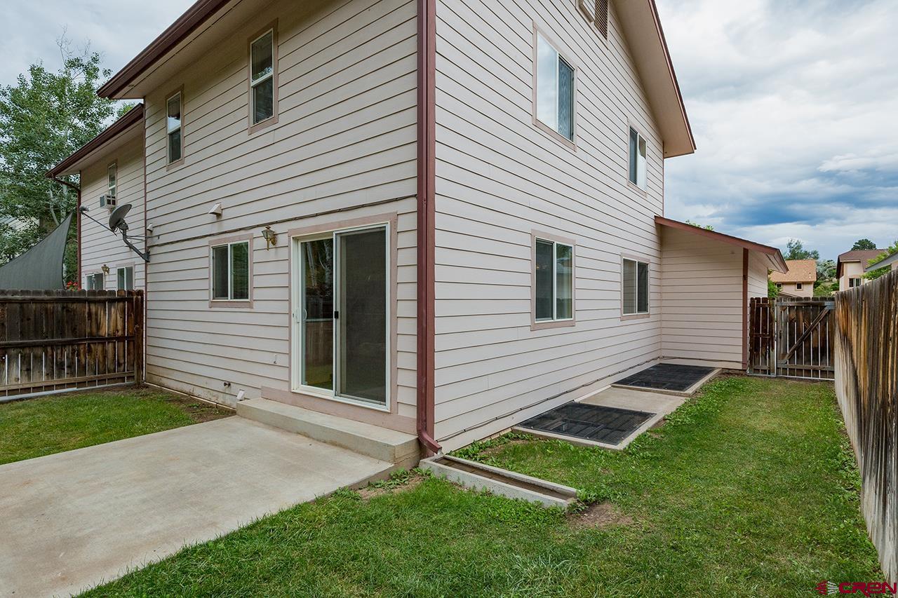 206 B Jenkins Ranch Road Durango, CO 81301 - Photo 25 of 27 a front view of a house with a yard