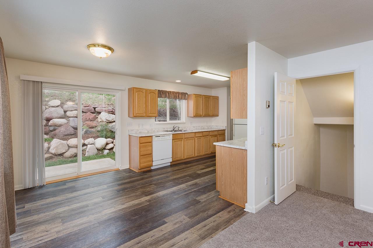206 B Jenkins Ranch Road Durango, CO 81301 - Photo 8 of 27 a view of a kitchen with wooden floor and electronic appliances