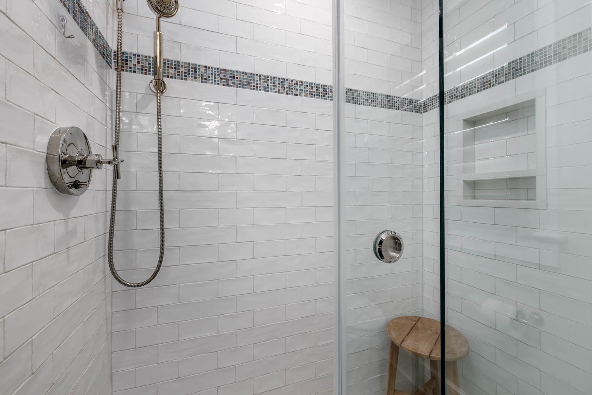 27 2nd Cape May, NJ 08204 - Photo 12 of 33 a bathroom shower with a glass shower door