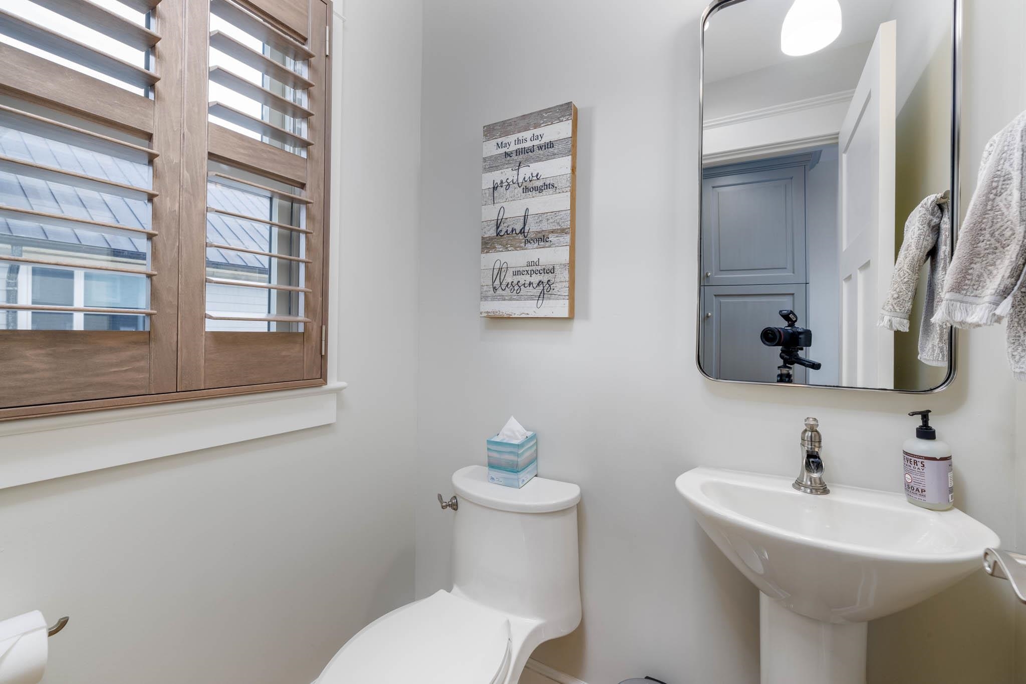 27 2nd Cape May, NJ 08204 - Photo 20 of 33 a bathroom with a toilet sink and mirror