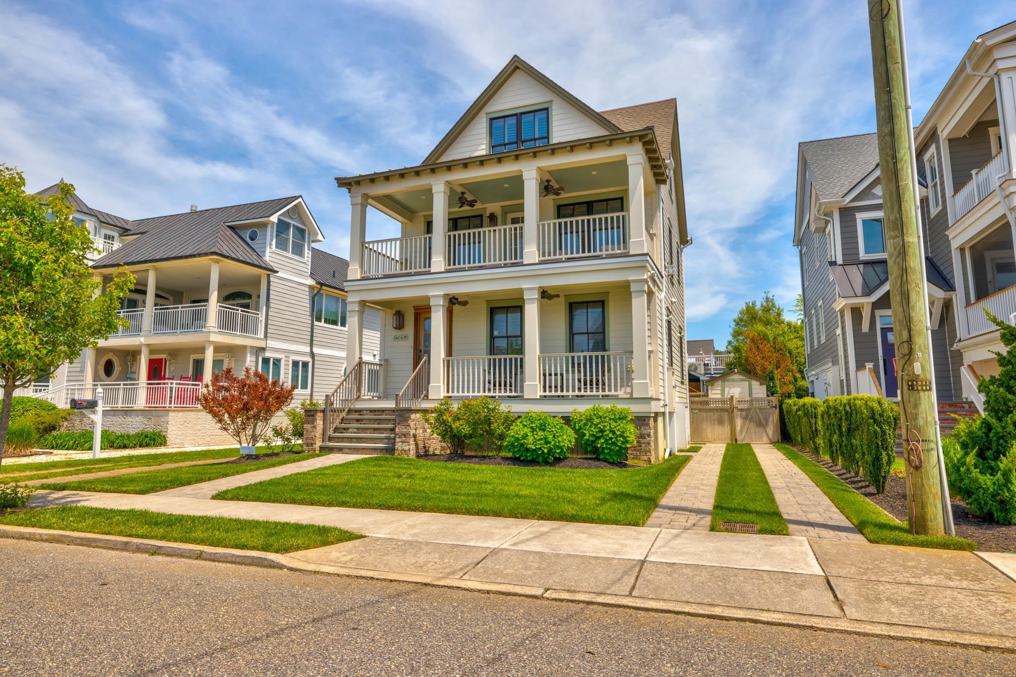27 2nd Cape May, NJ 08204 - Photo 25 of 33 a front view of a residential apartment building with a yard