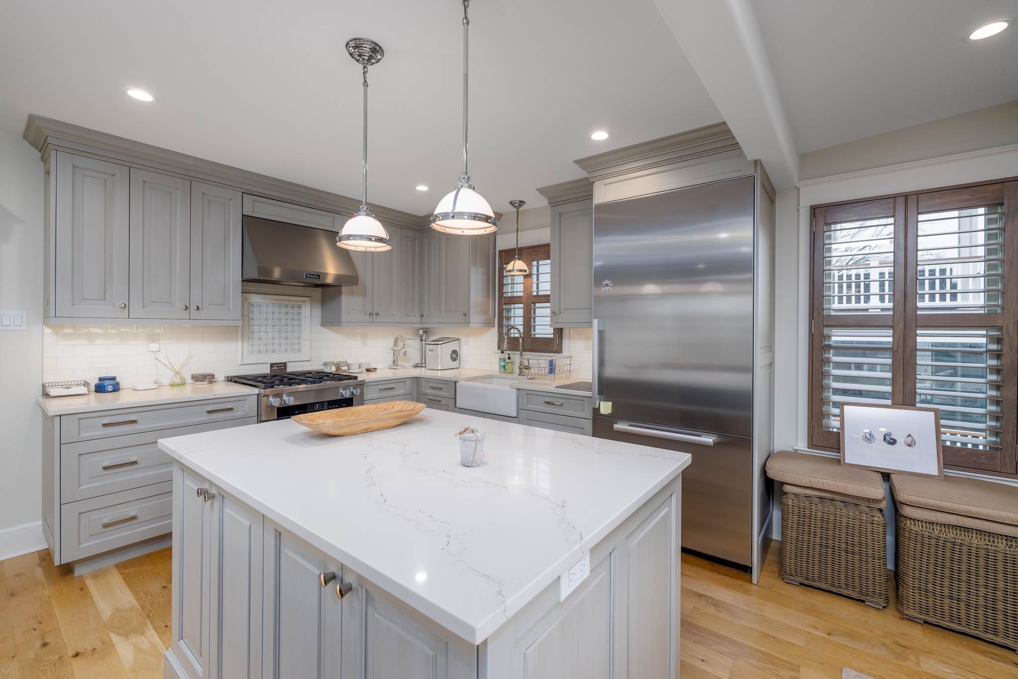 27 2nd Cape May, NJ 08204 - Photo 4 of 33 a kitchen that has a lot of cabinets in it and wooden floors