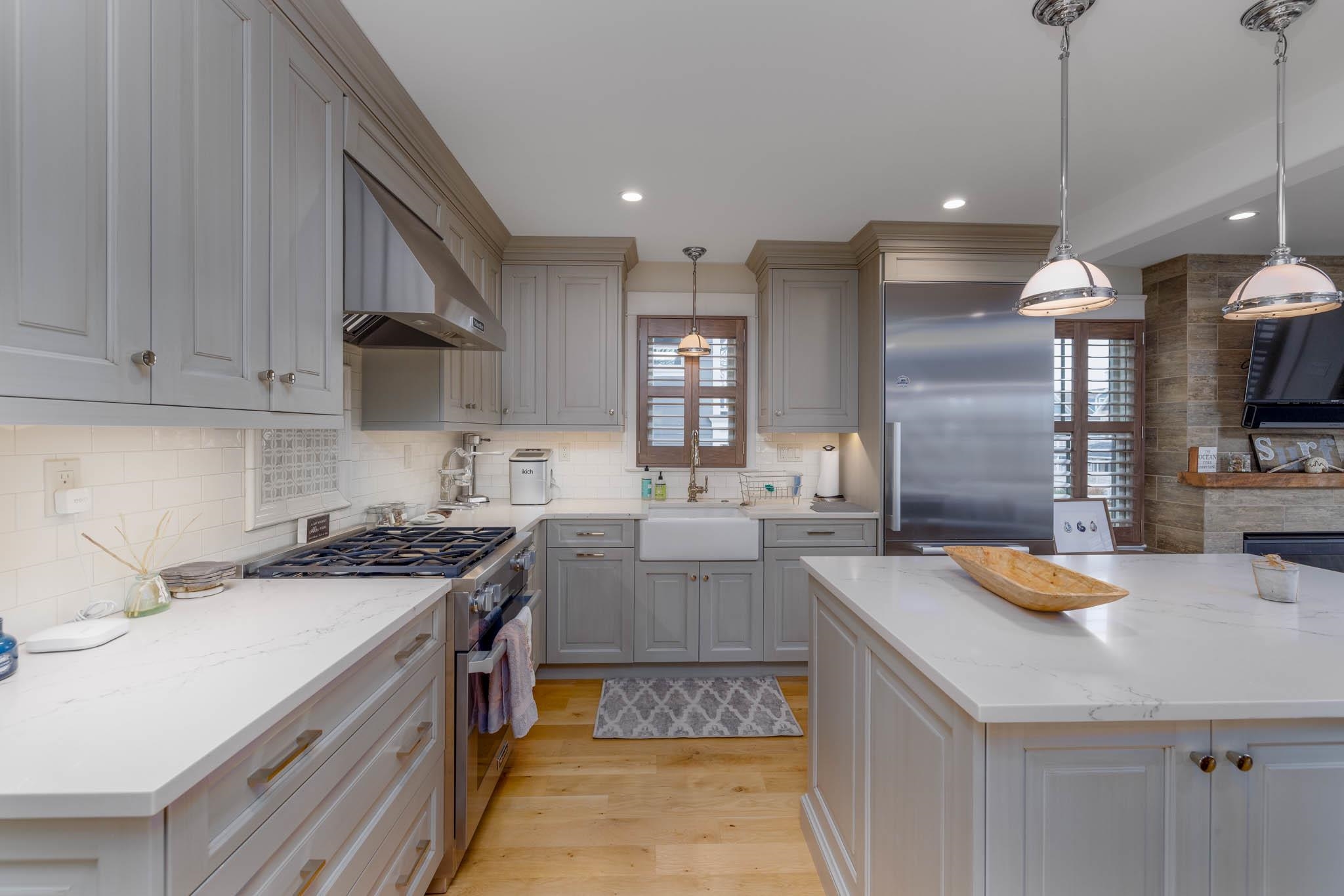 27 2nd Cape May, NJ 08204 - Photo 5 of 33 a kitchen with a sink stove and cabinets