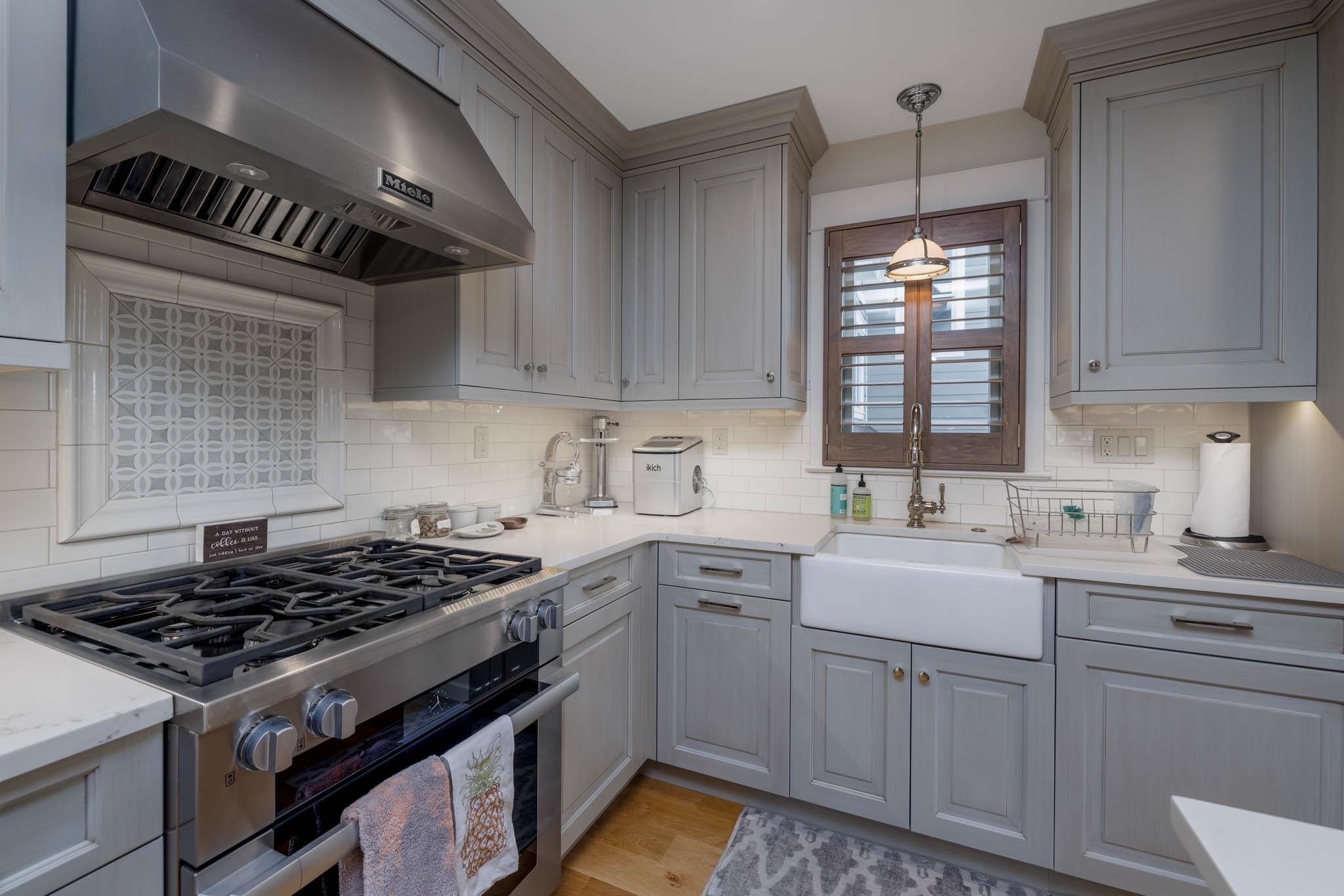 27 2nd Cape May, NJ 08204 - Photo 6 of 33 a kitchen with cabinets appliances a sink and a window