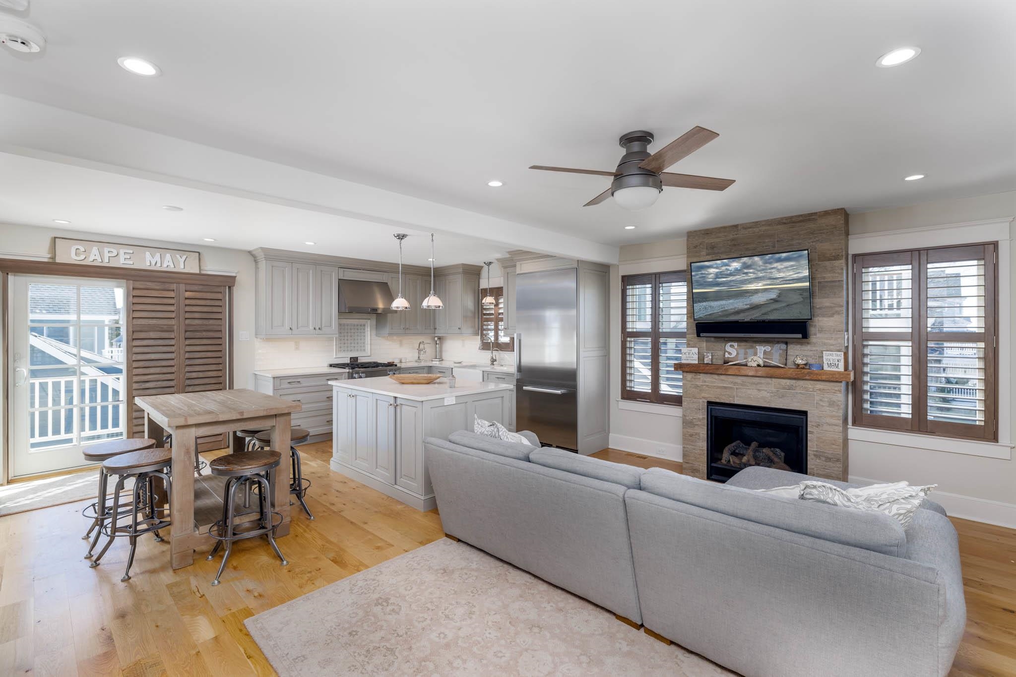 27 2nd Cape May, NJ 08204 - Photo 8 of 33 a living room with furniture a fireplace and a flat screen tv