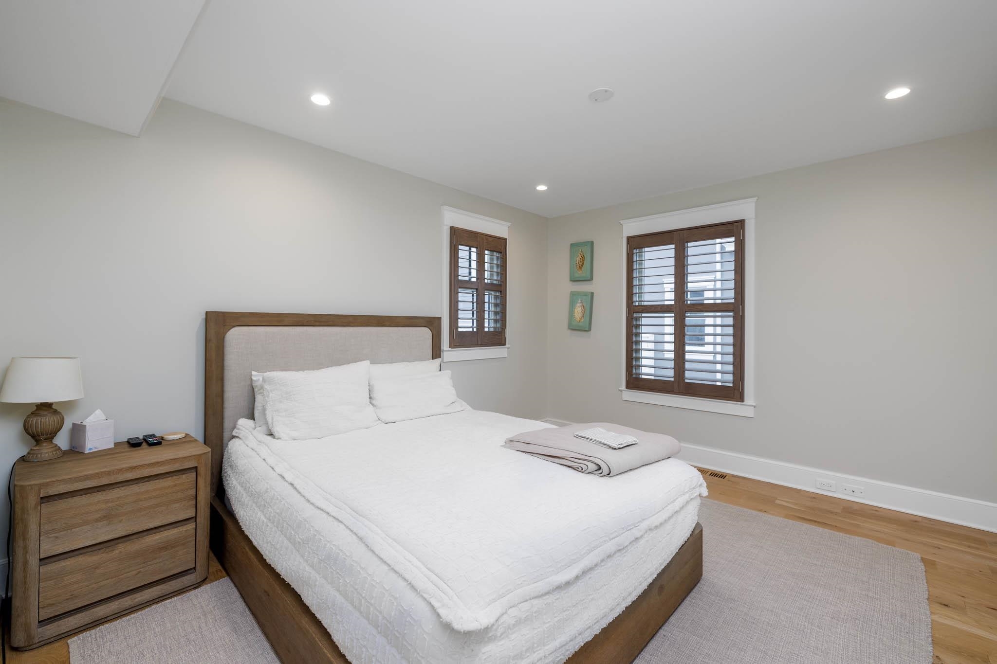 27 2nd Cape May, NJ 08204 - Photo 10 of 33 a bedroom with a bed and a window