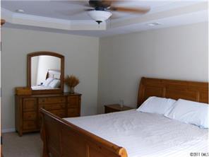 348 Sand Paver Way Fort Mill, SC 29708 - Photo 11 of 16 a bedroom with a bed and a dresser