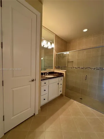 a large bathroom with a large tub and shower