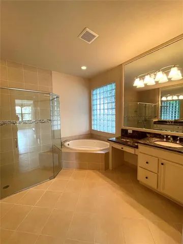 a view of an empty room with window and fireplace