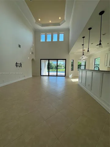 a view of an empty room with a fireplace