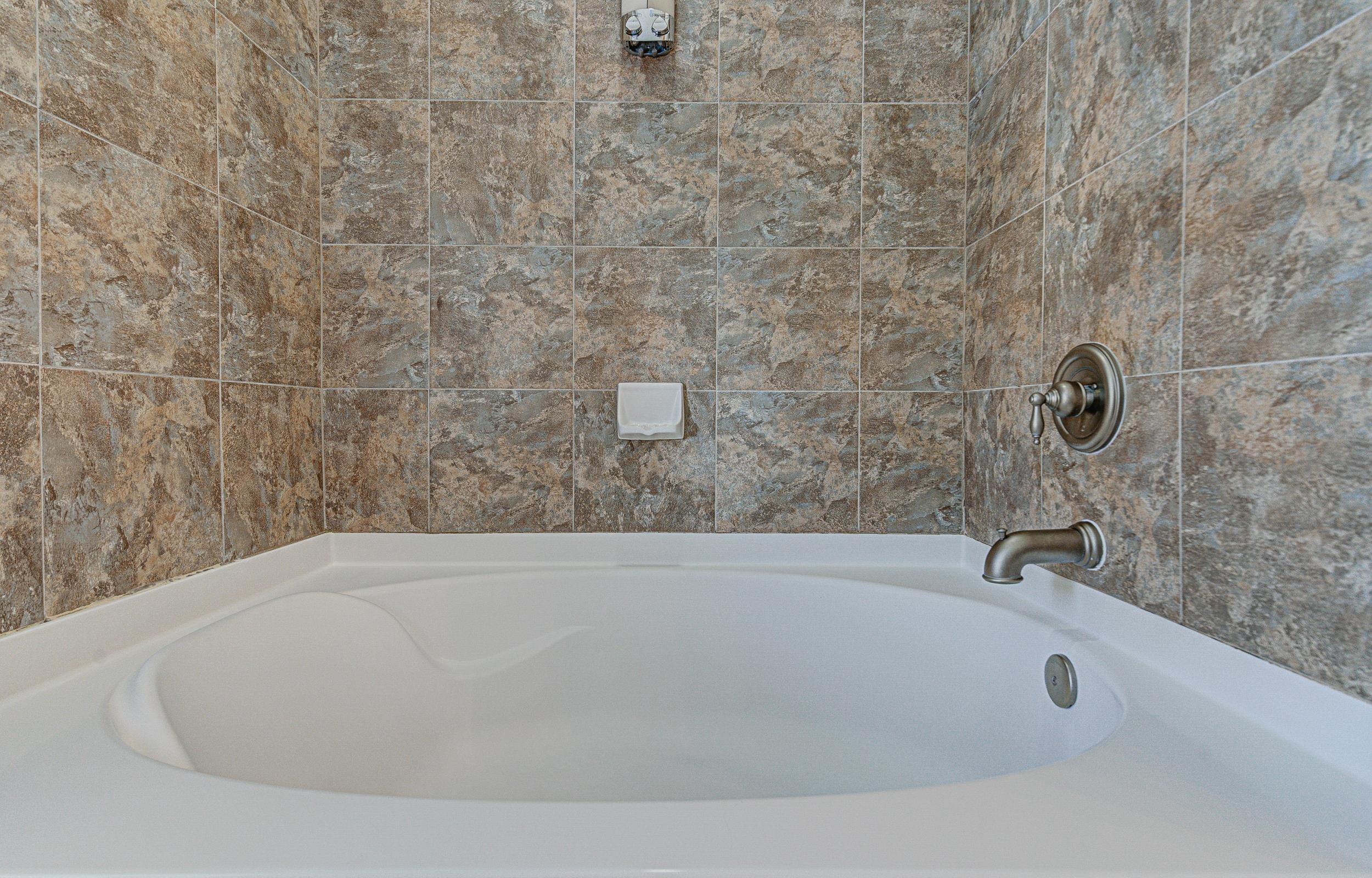 101 West Bank, Unit 51 Horseshoe Bay, TX 78657 - Photo 16 of 30 a bathroom with a bathtub