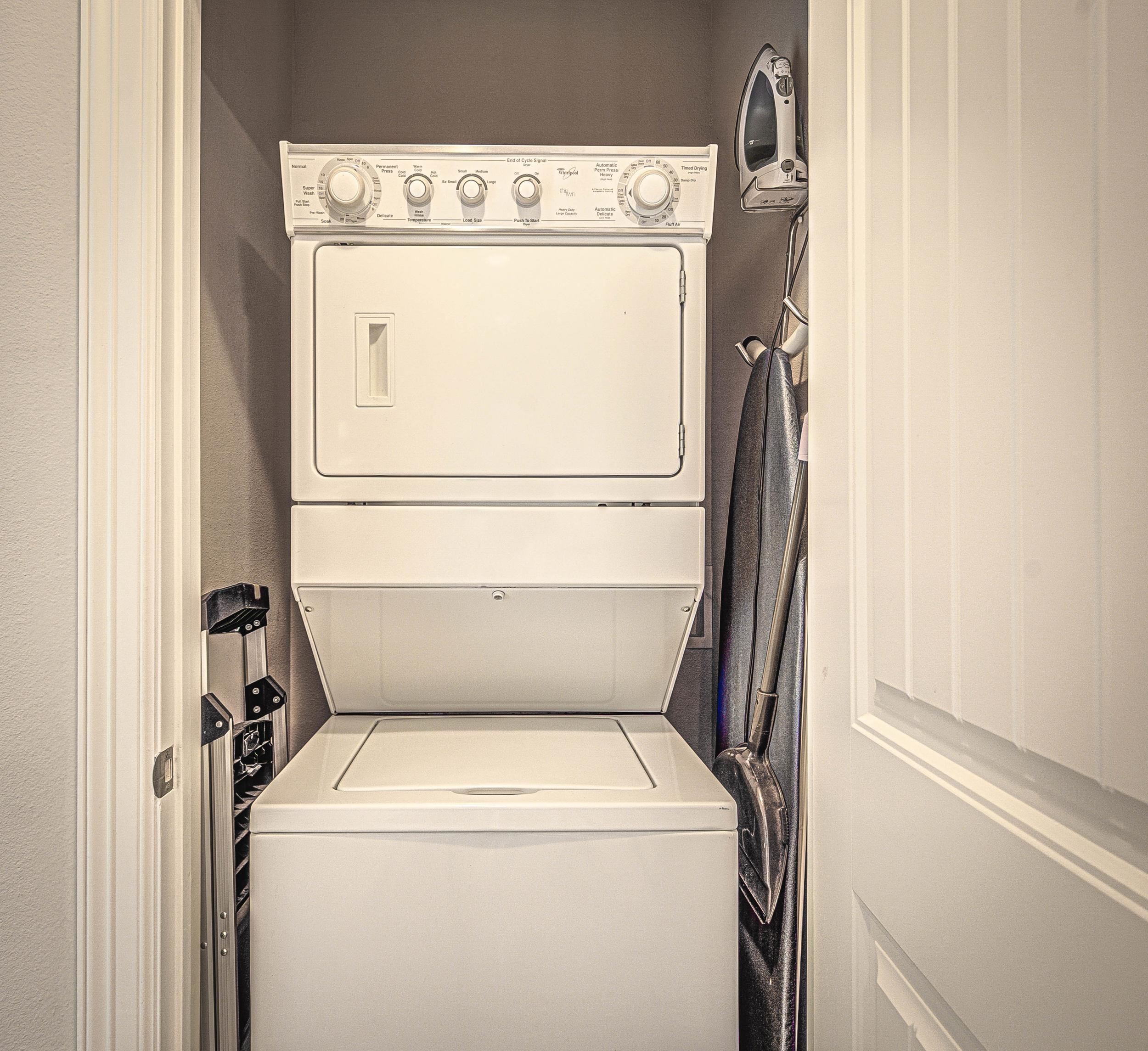 101 West Bank, Unit 51 Horseshoe Bay, TX 78657 - Photo 17 of 30 a utility room with dryer and washer