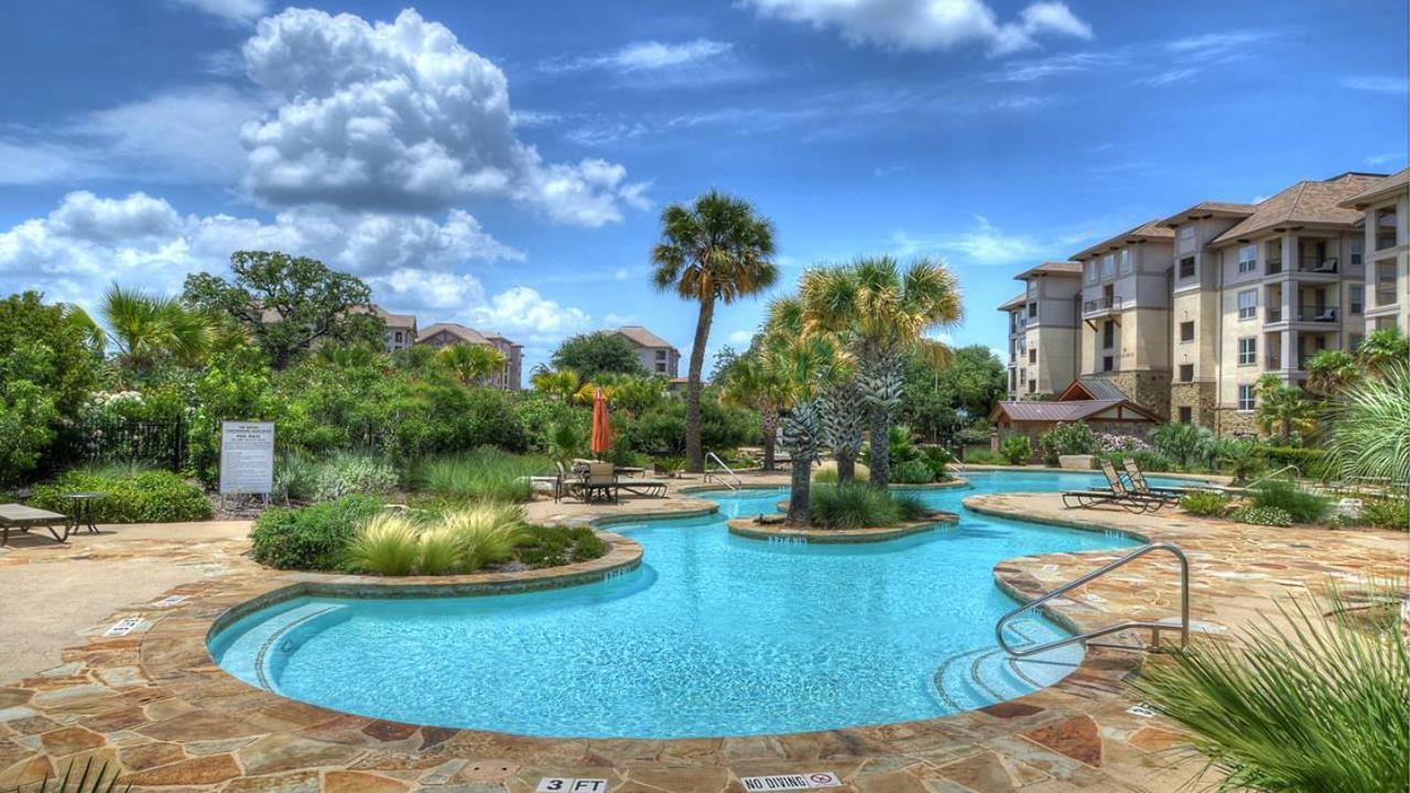 101 West Bank, Unit 51 Horseshoe Bay, TX 78657 - Photo 20 of 30 a view of a swimming pool with a patio