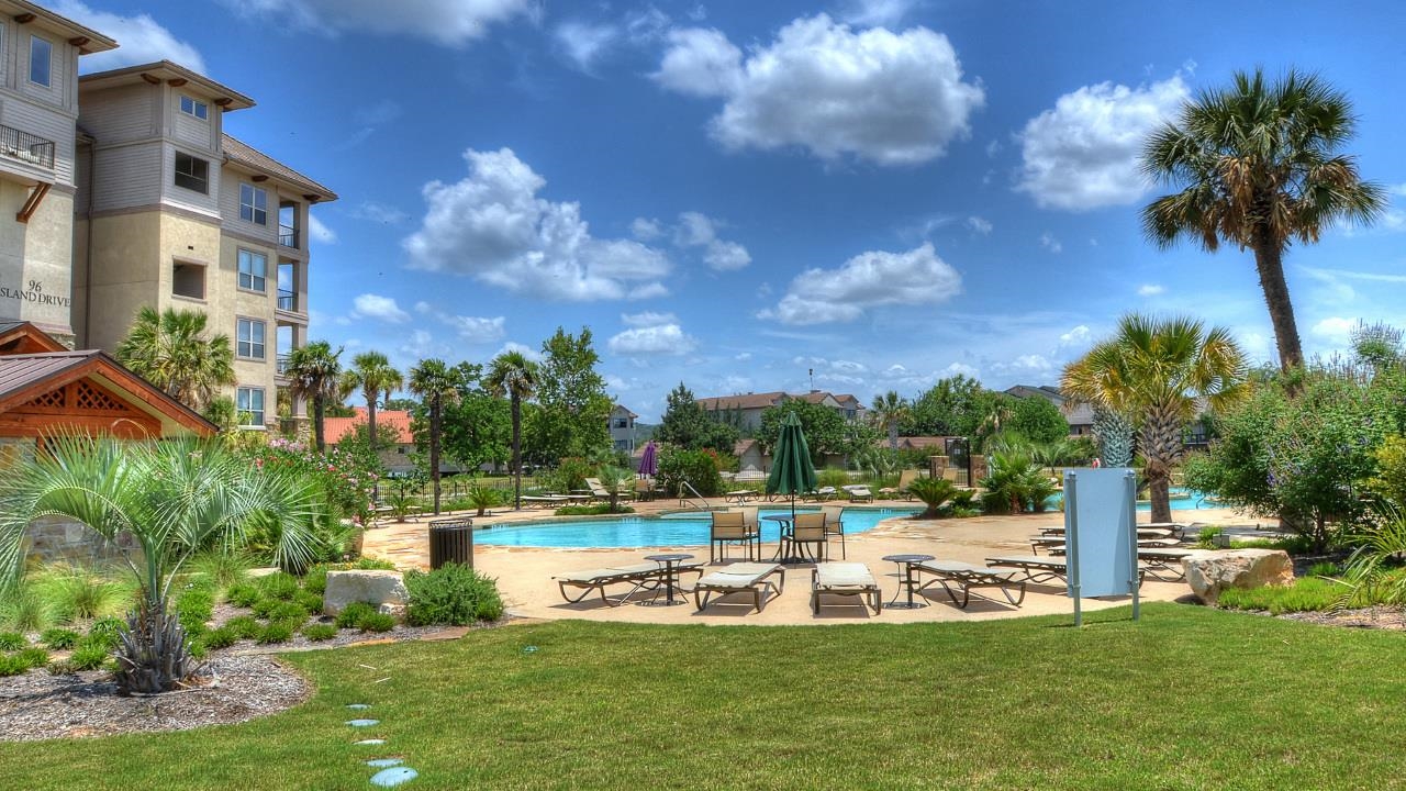 101 West Bank, Unit 51 Horseshoe Bay, TX 78657 - Photo 21 of 30 a view of a house with a big yard
