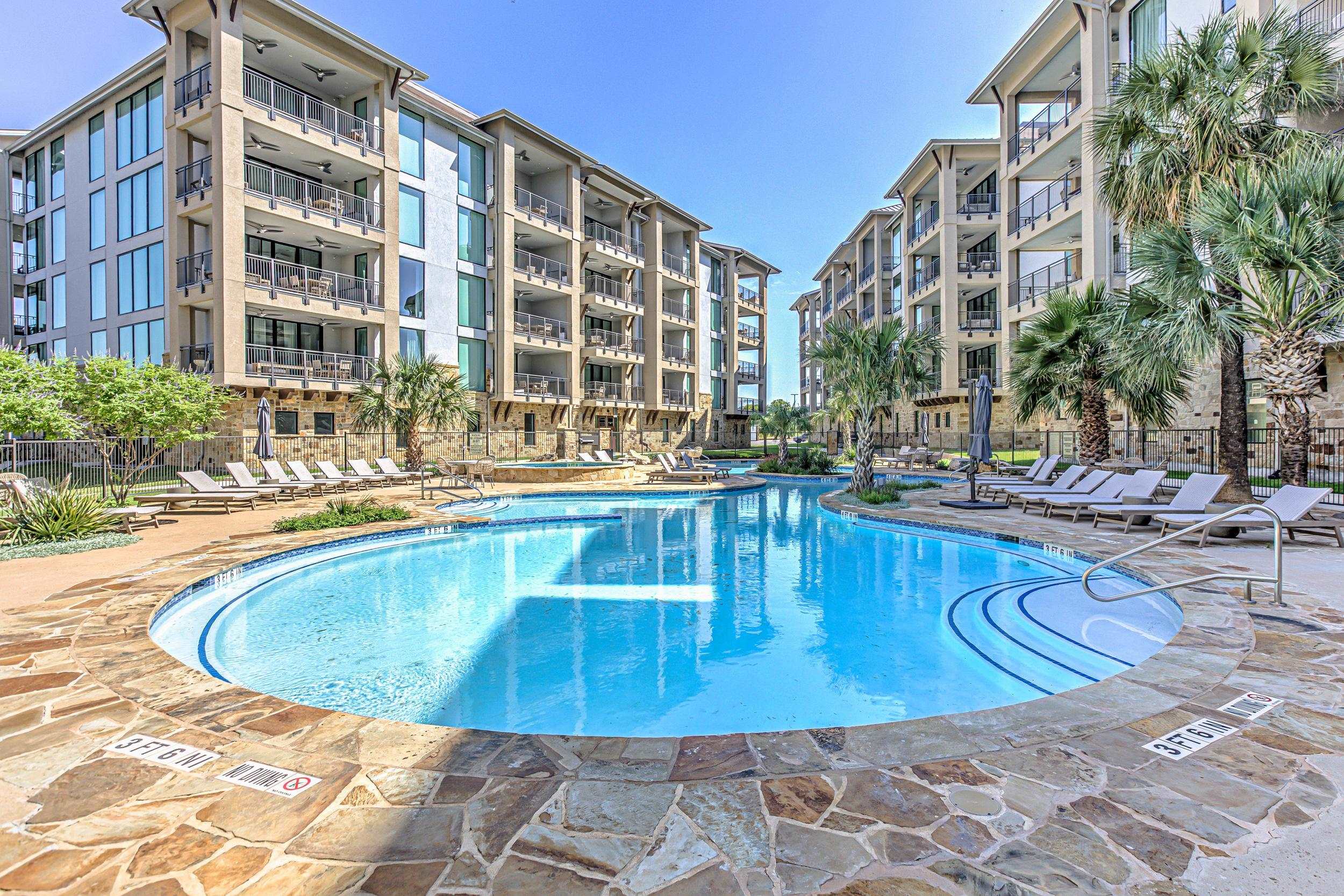101 West Bank, Unit 51 Horseshoe Bay, TX 78657 - Photo 23 of 30 a view of a swimming pool with outdoor seating