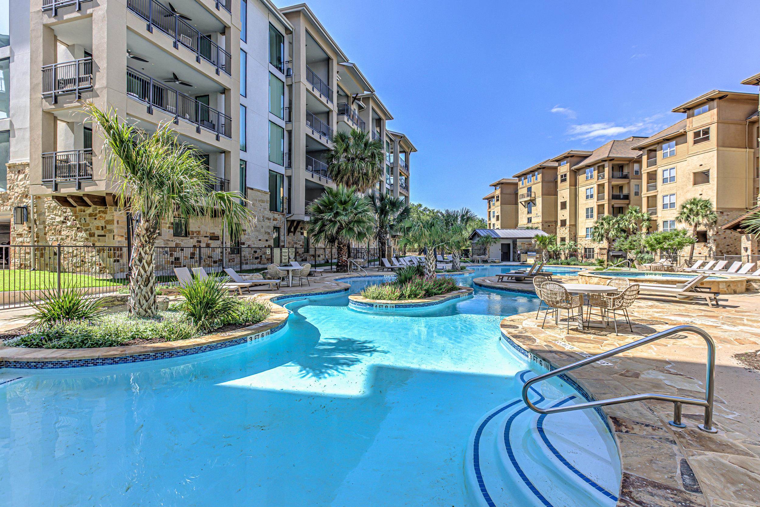 101 West Bank, Unit 51 Horseshoe Bay, TX 78657 - Photo 24 of 30 a view of a swimming pool with outdoor seating