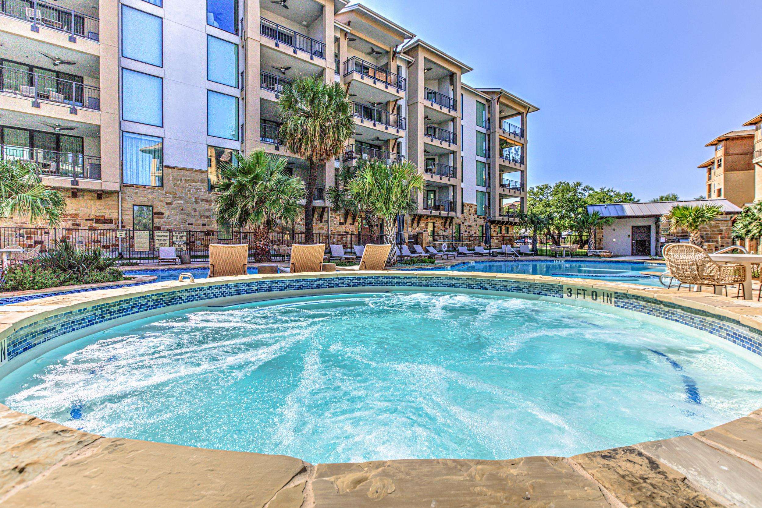 101 West Bank, Unit 51 Horseshoe Bay, TX 78657 - Photo 25 of 30 a view of a building with a yard