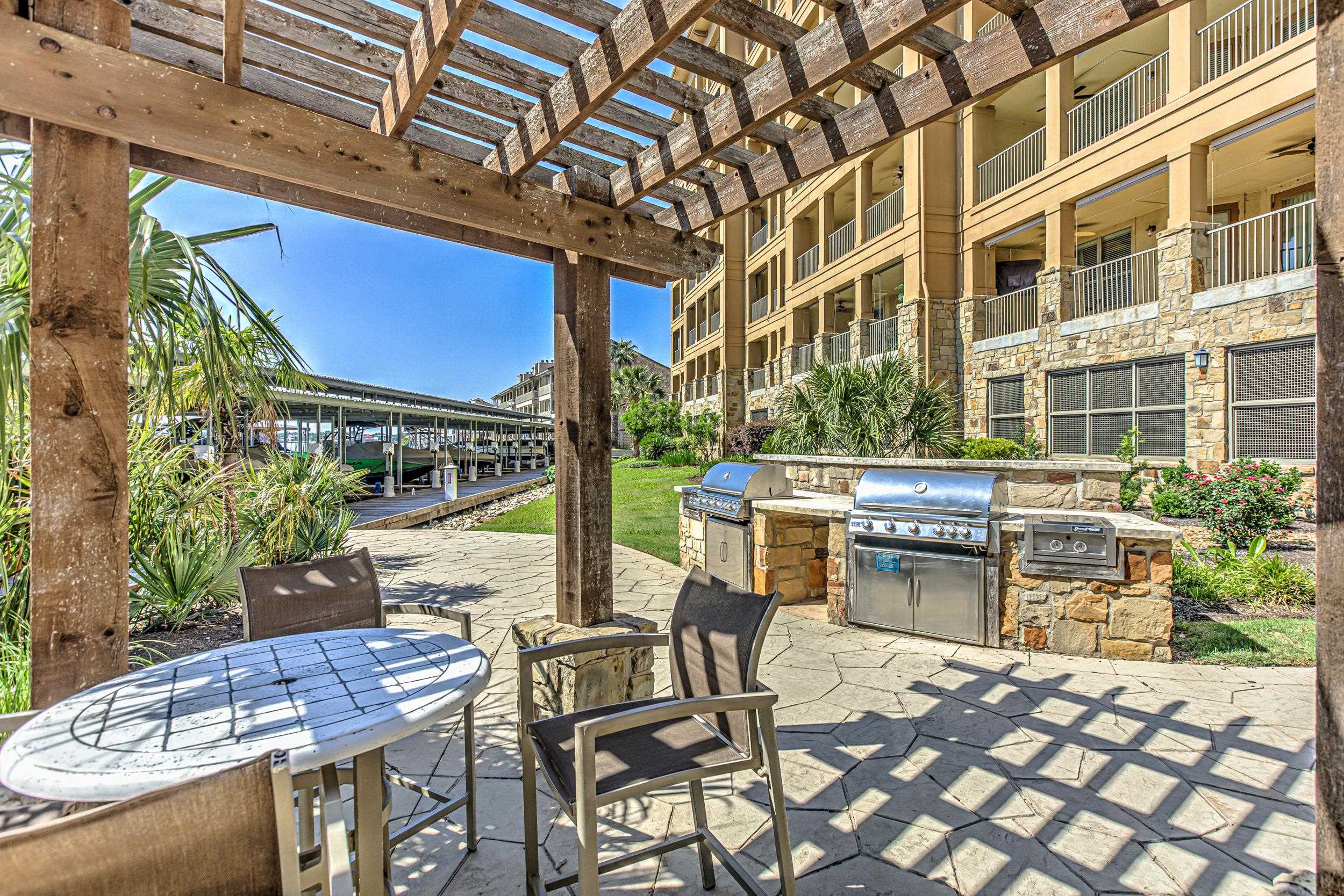 101 West Bank, Unit 51 Horseshoe Bay, TX 78657 - Photo 28 of 30 a view of an outdoor space with seating area