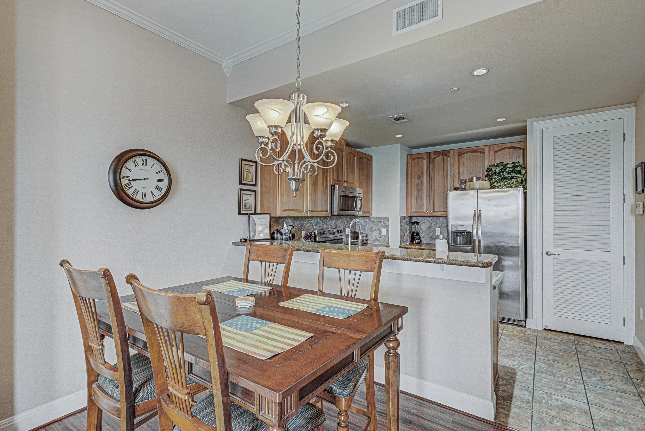 101 West Bank, Unit 51 Horseshoe Bay, TX 78657 - Photo 7 of 30 a view of a dining room with furniture and kitchen view