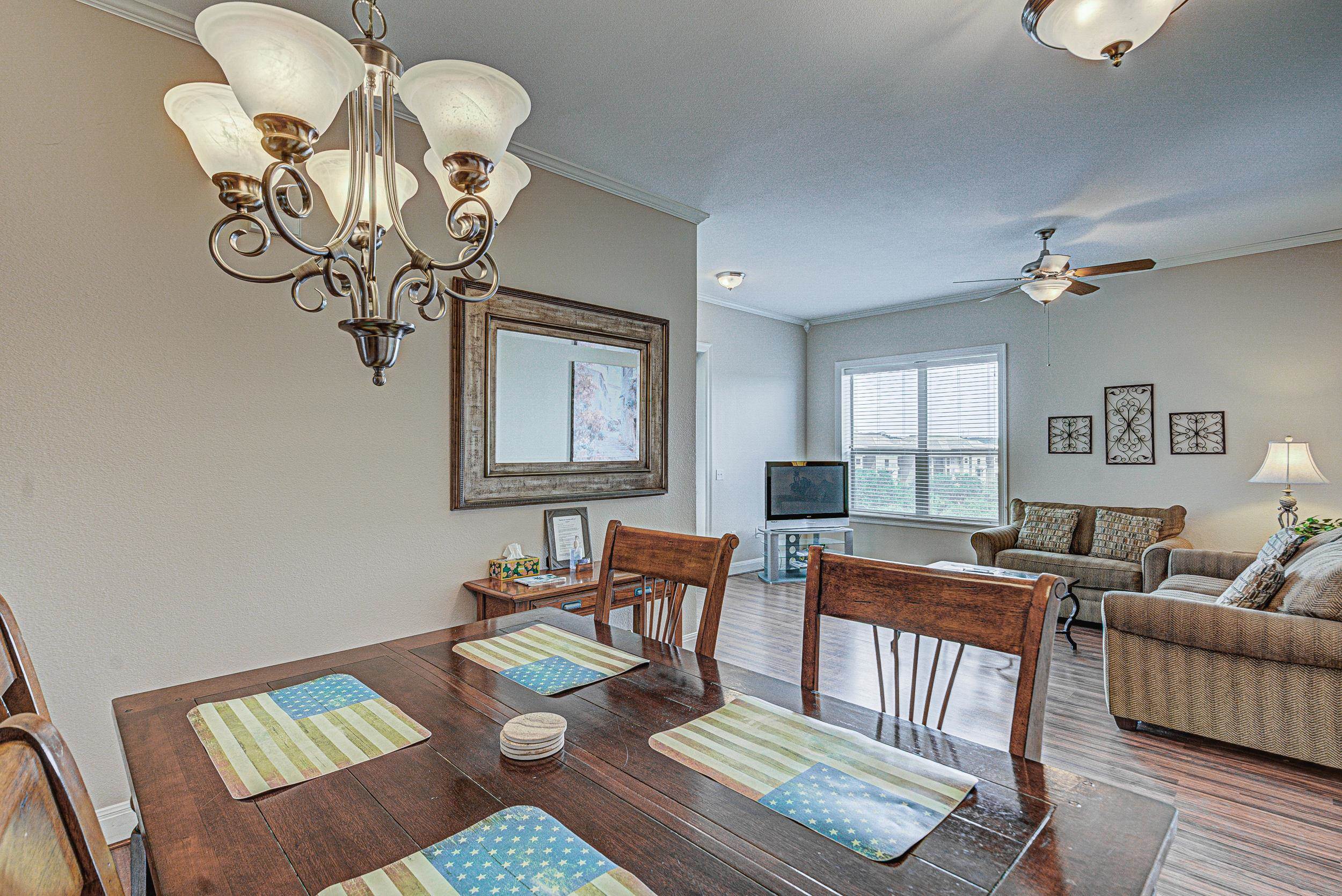 101 West Bank, Unit 51 Horseshoe Bay, TX 78657 - Photo 8 of 30 a living room with furniture and wooden floor