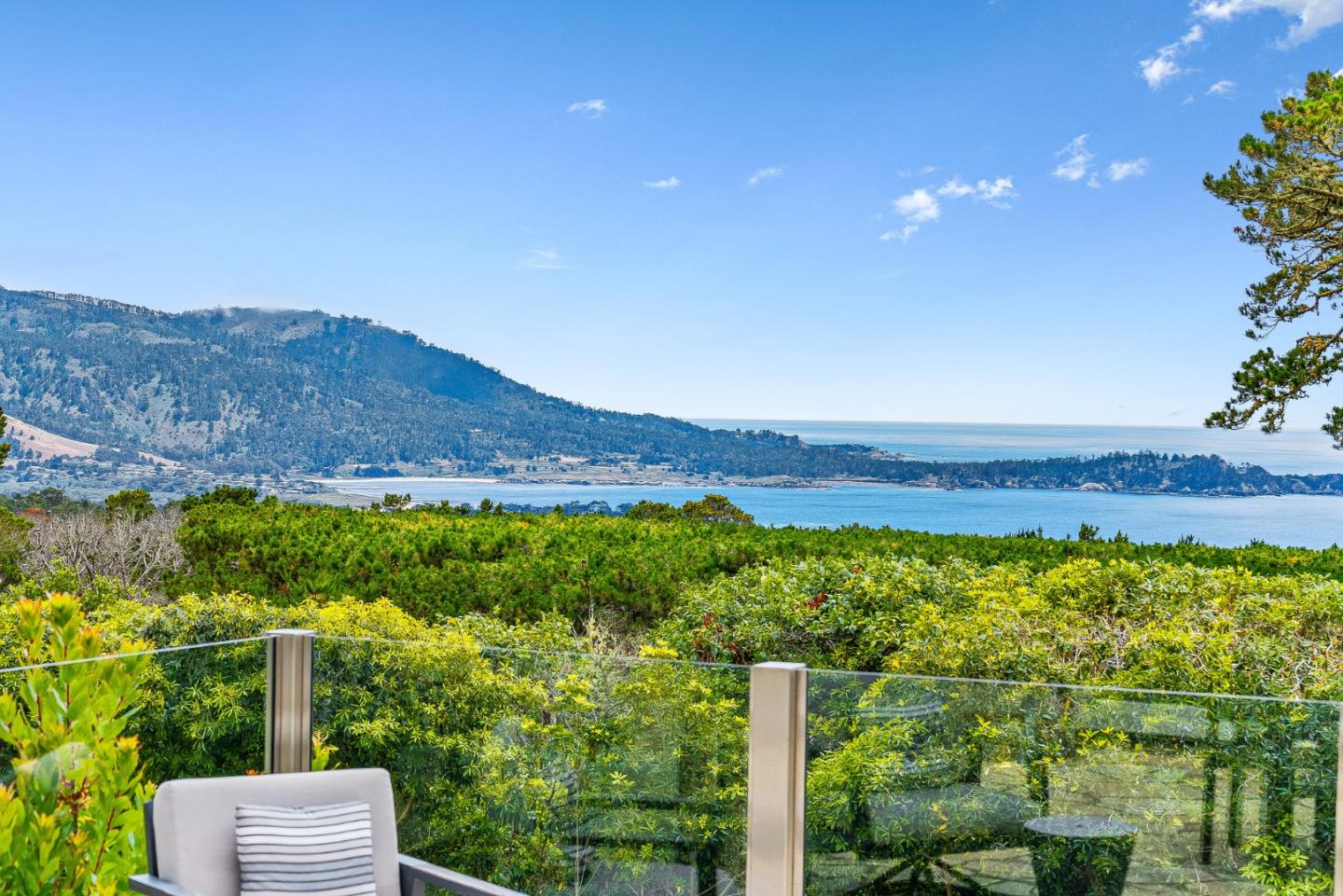 4038 Sunridge Road Pebble Beach, CA 93953 - Photo 46 of 48 a view of a lush green hillside and a houses