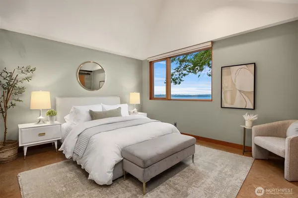 a bedroom with a bed and a couch