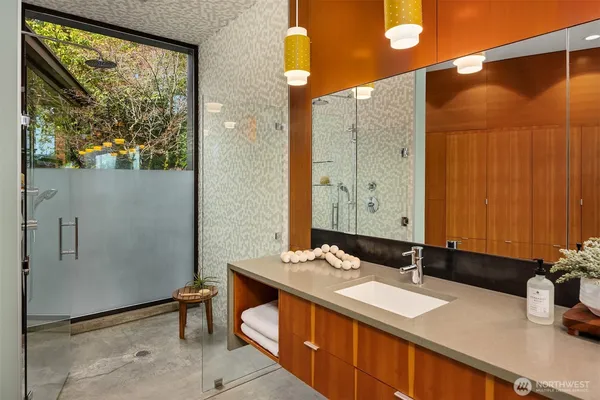 a bathroom with a sink and a mirror