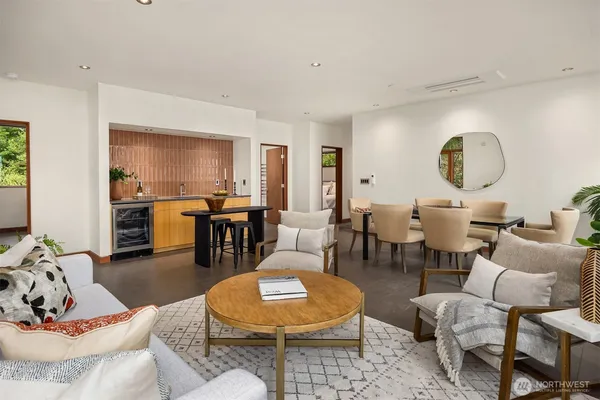 a living room with furniture and a potted plant