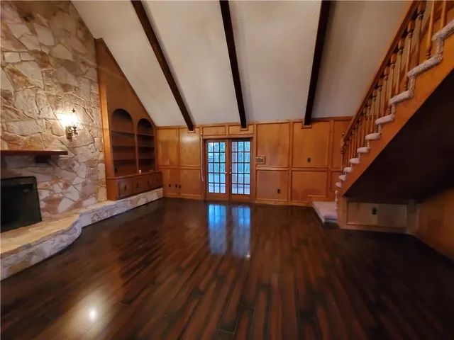a view of an entryway with wooden floor