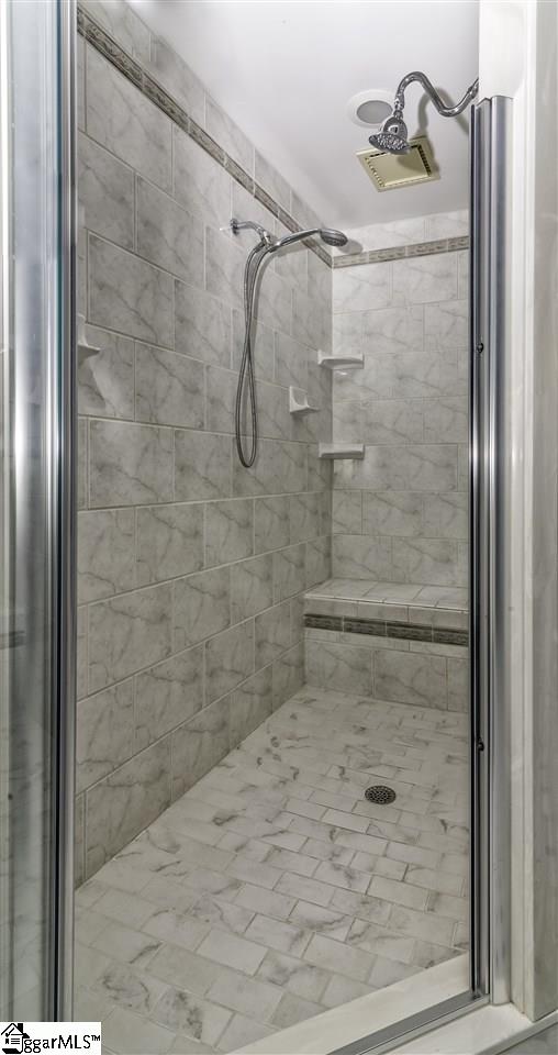 220 Block House Road Greenville, SC 29615 - Photo 22 of 36 Custom Tile Shower with Dual Shower Heads and Bench Seating