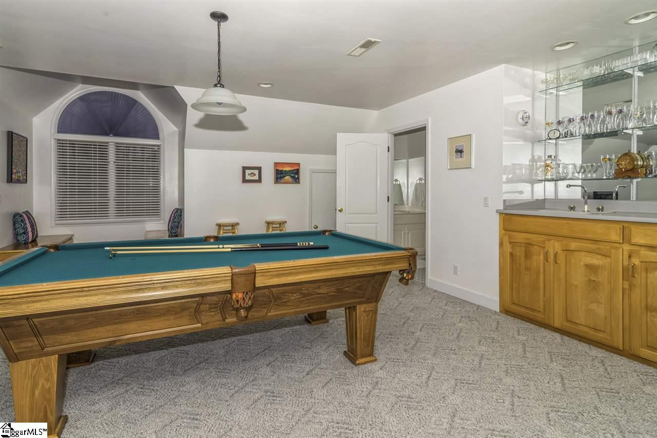 220 Block House Road Greenville, SC 29615 - Photo 27 of 36 HUGE 28X20 Bonus Room with Built-in Bar, Complete with Sink, Shelving and Storage. There is also a 1/2 Bath, 2 Large Windows with Bench Seating and Closeted Storage.