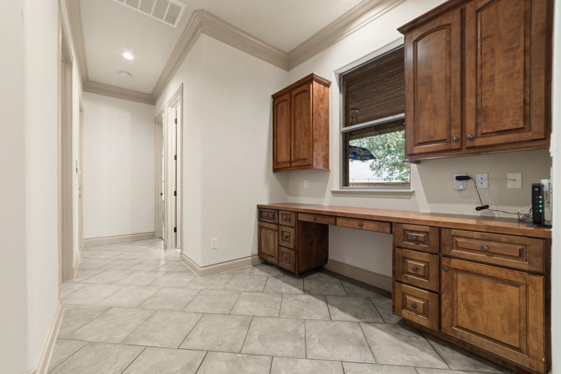 139 Ware Drive Buda, TX 78610 - Photo 18 of 40 a kitchen with stainless steel appliances granite countertop a sink and cabinets