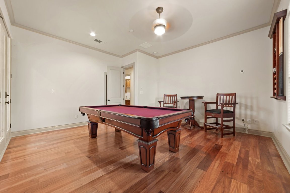 139 Ware Drive Buda, TX 78610 - Photo 20 of 40 a room with wooden floor and pool table