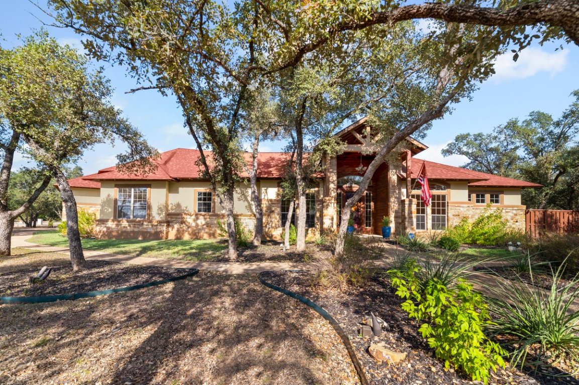 139 Ware Drive Buda, TX 78610 - Photo 2 of 40 a front view of a house with a yard