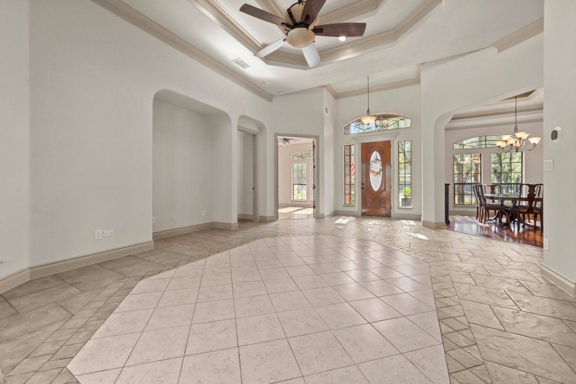 139 Ware Drive Buda, TX 78610 - Photo 7 of 40 a view of a livingroom with a chandelier fan and windows