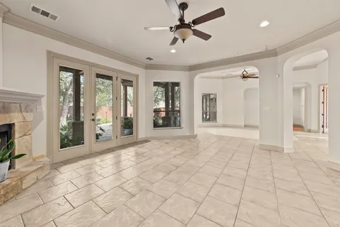 a view of an entryway with wooden floor and a fireplace