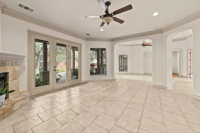 a view of an entryway with wooden floor and a fireplace