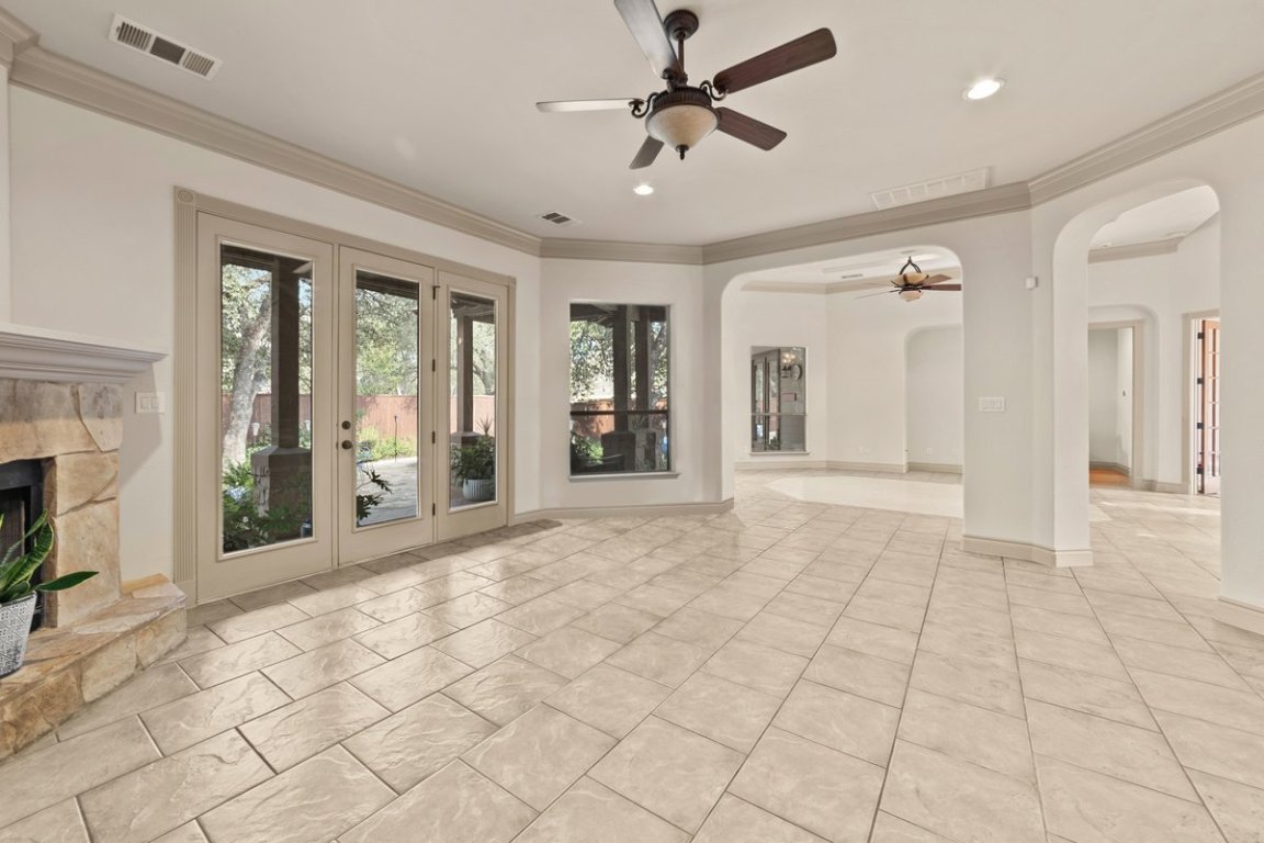 139 Ware Drive Buda, TX 78610 - Photo 8 of 40 a view of an entryway with wooden floor and a fireplace