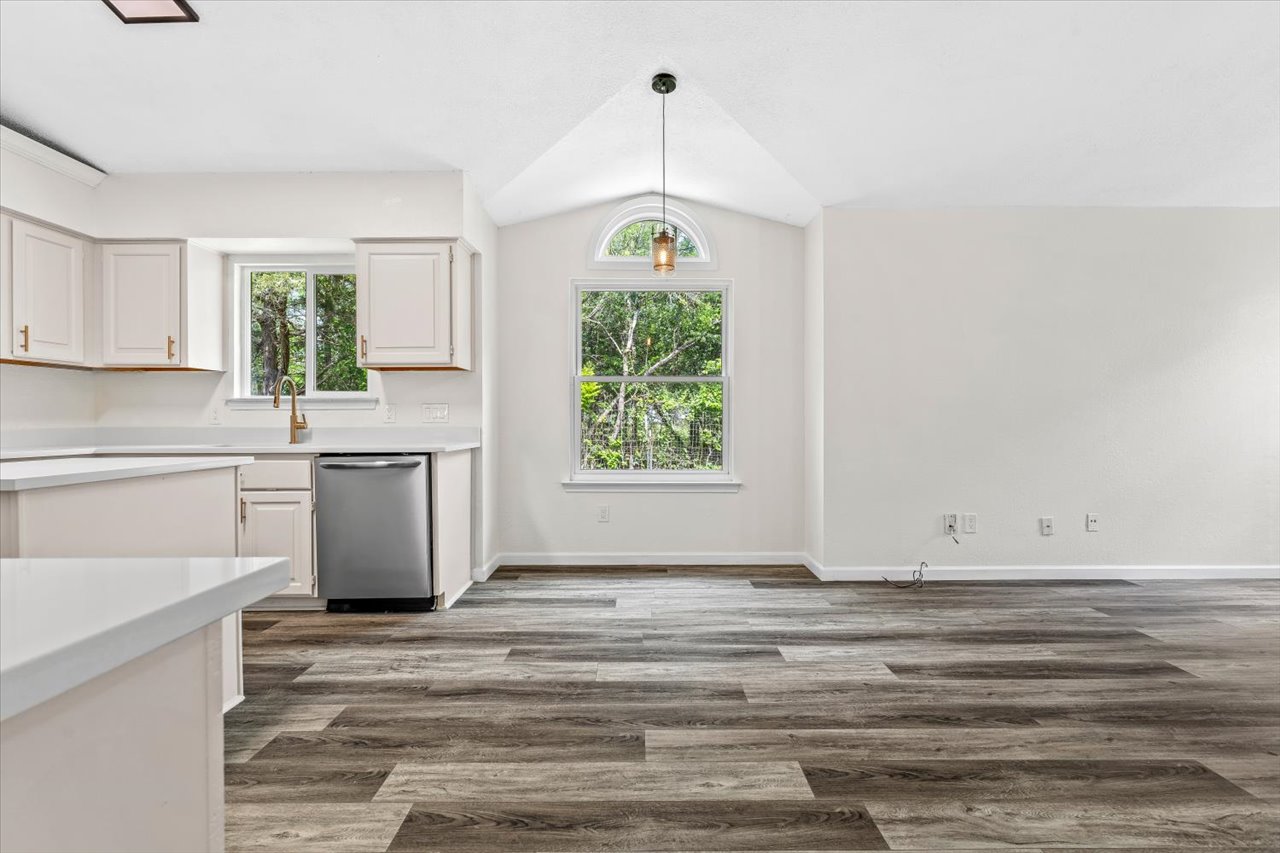 4004 Danli Lane Austin, TX 78749 - Photo 20 of 40 a kitchen with white cabinets and window