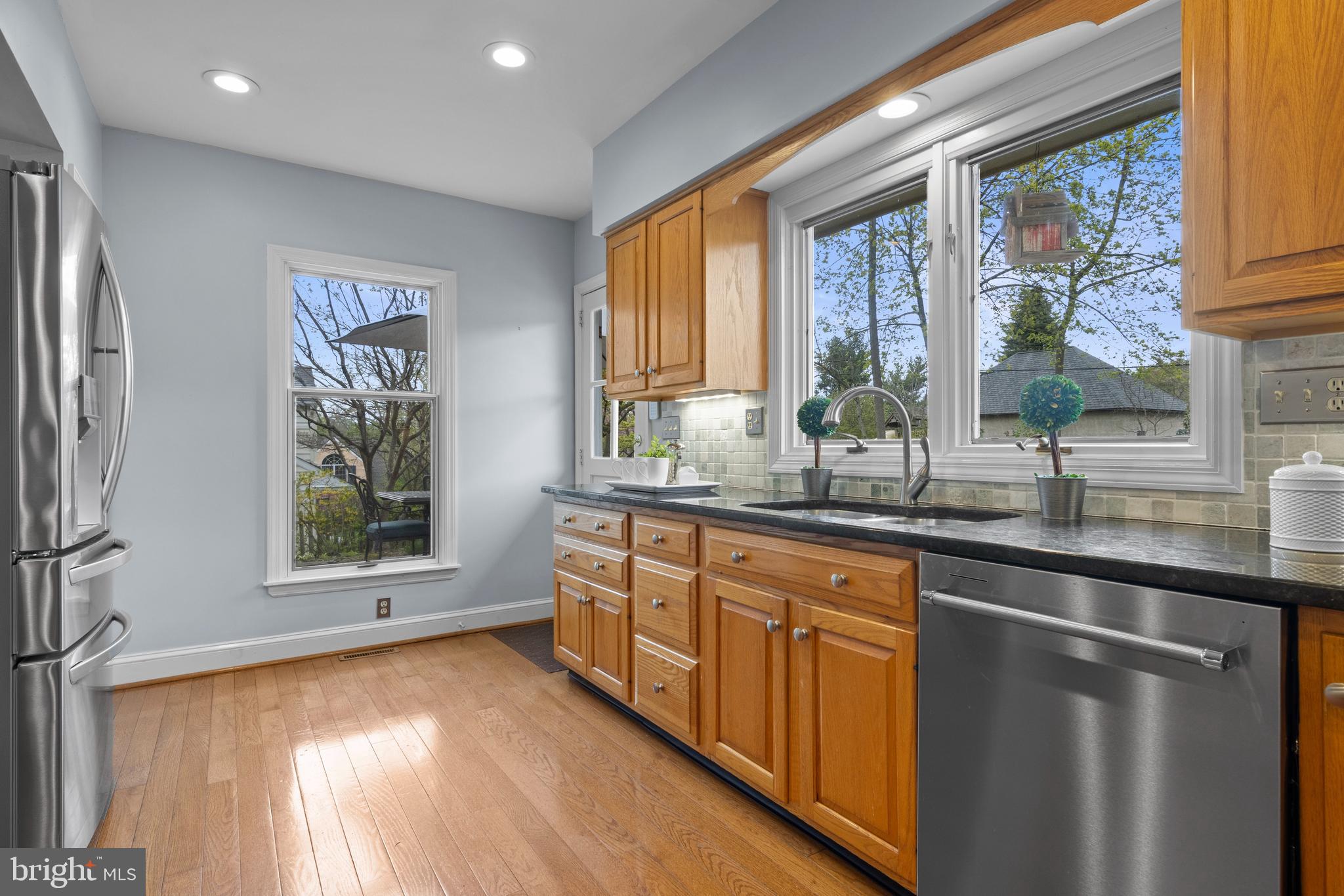 421 St Davids Road Wayne, PA 19087 - Photo 18 of 39 a kitchen with stainless steel appliances granite countertop a stove a sink and a refrigerator