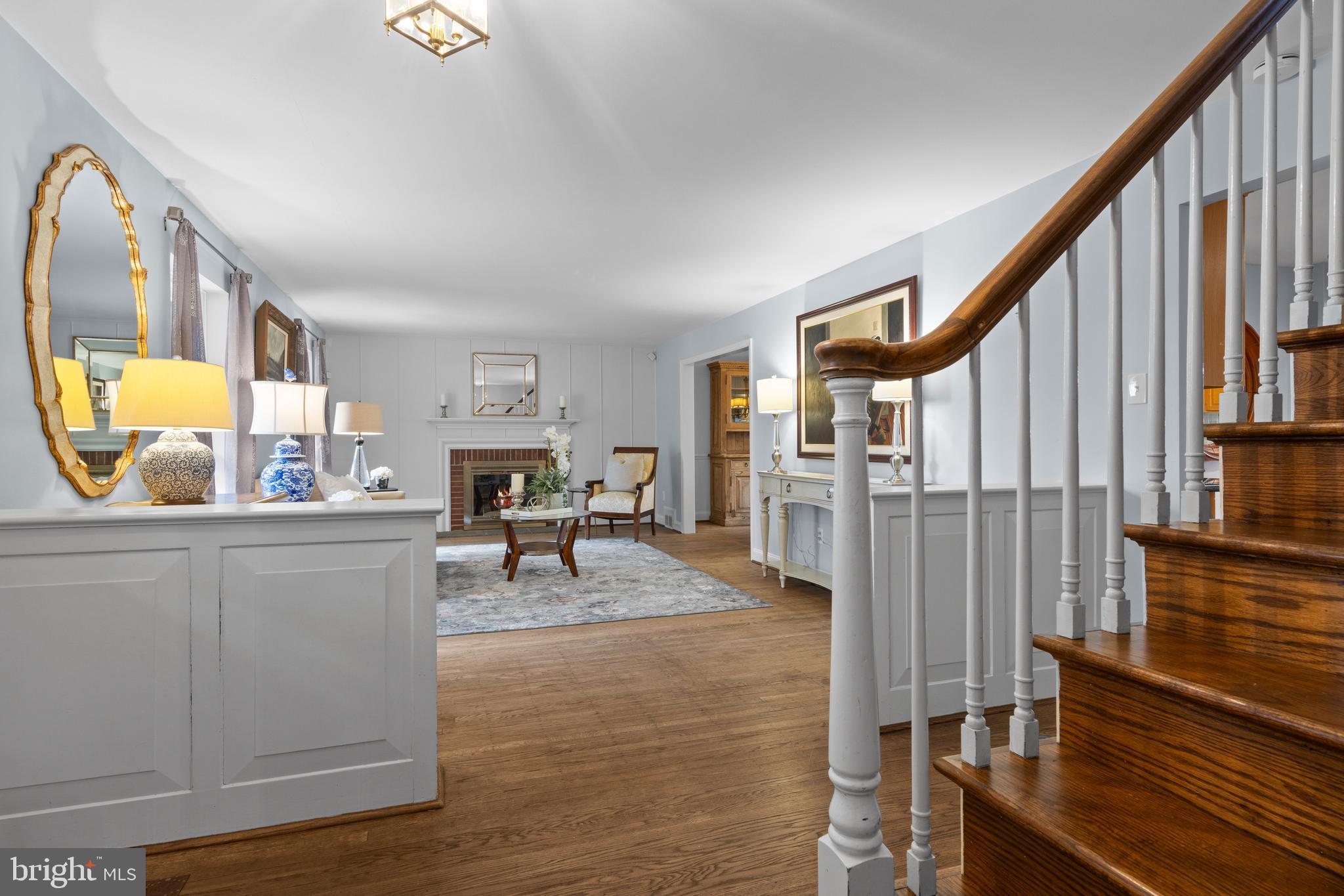 421 St Davids Road Wayne, PA 19087 - Photo 2 of 39 a living room with furniture and a fireplace